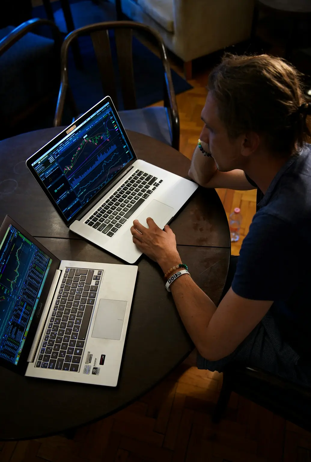 Private equity professionals collaborating with laptops and documents