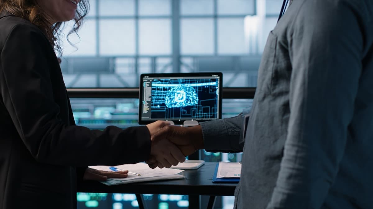 A hiring manager and an AI specialist candidate in an interview conversation, representing team-building for AI initiatives
