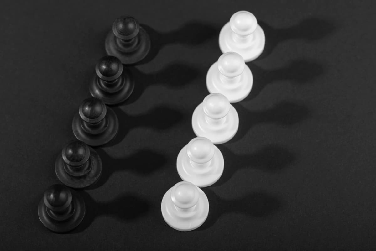 Two rows of chess pawns advancing in sequence, representing a deliberate, evidence-based roadmap